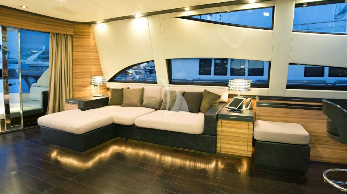 a large living room with a large screen aboard VITAMIN SEA I Yacht for Sale