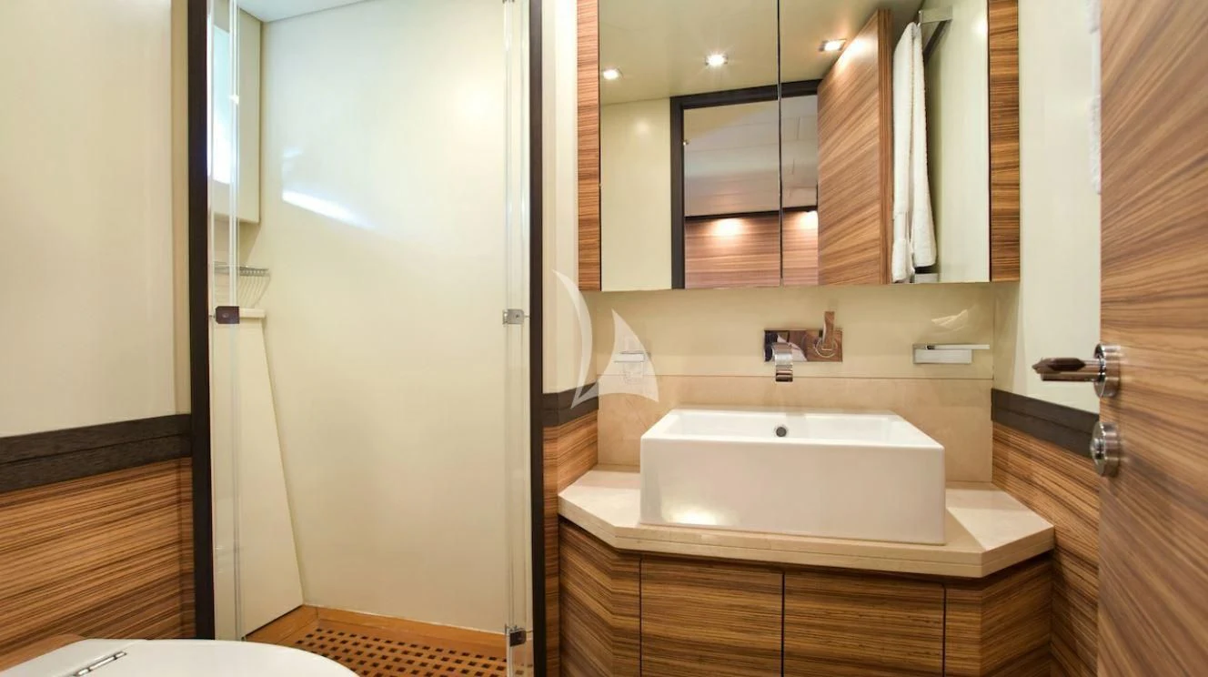 a bathroom with a sink and a mirror aboard VITAMIN SEA I Yacht for Sale