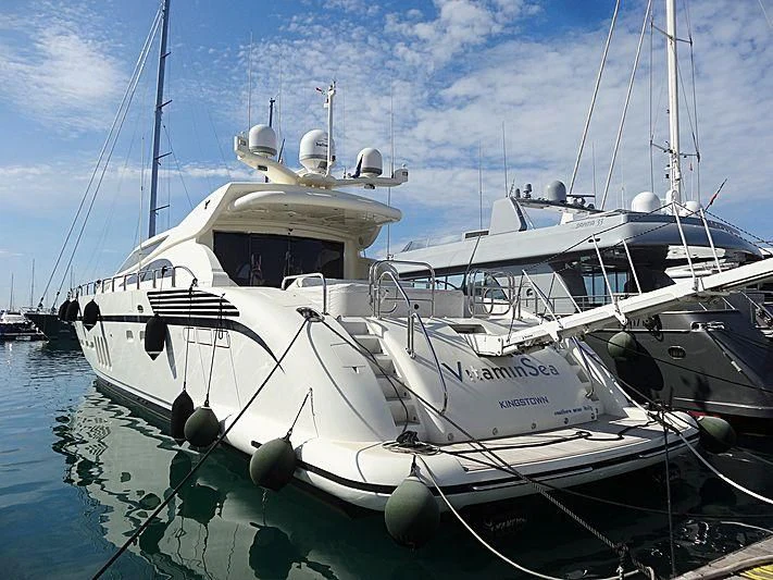a couple of boats are parked in a harbor aboard VITAMIN SEA I Yacht for Sale