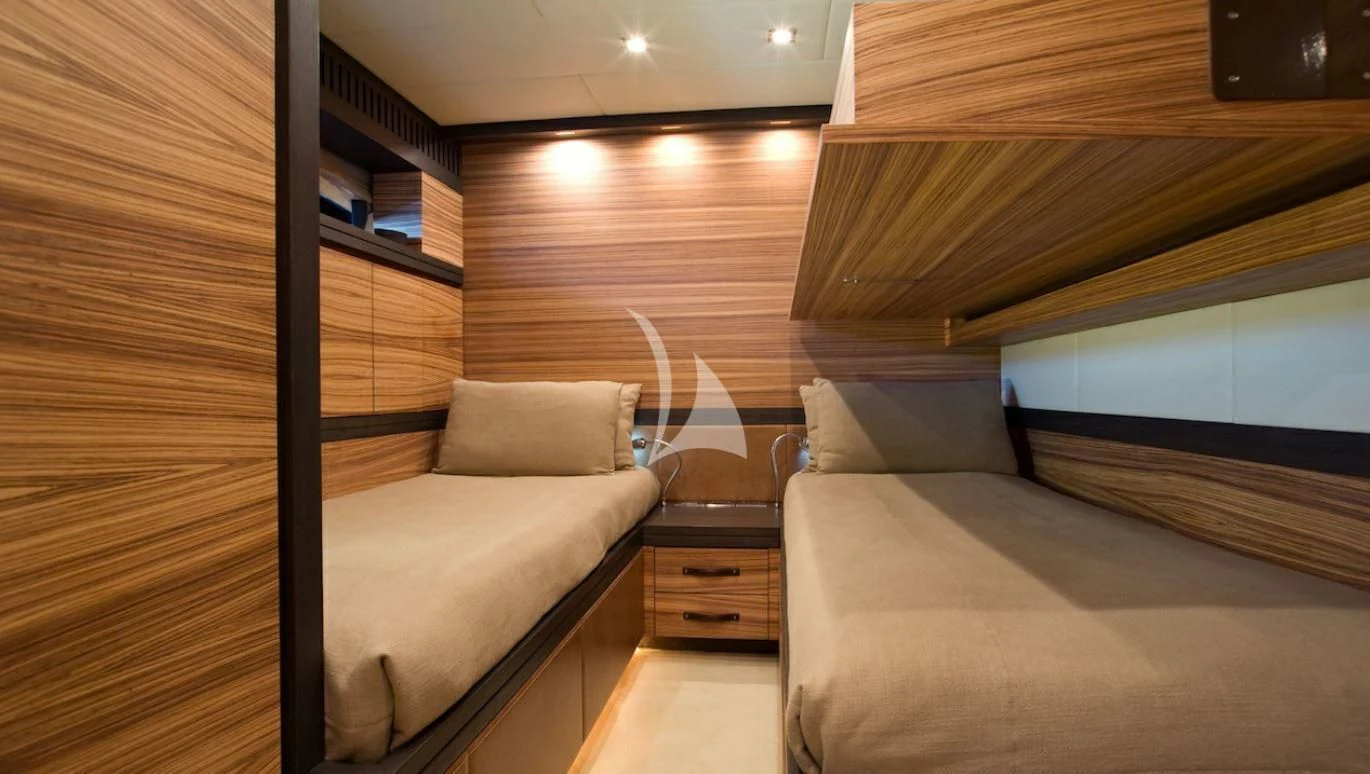 a room with a bed and a couch aboard VITAMIN SEA I Yacht for Sale