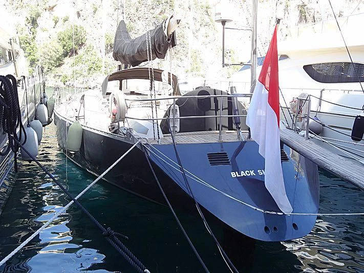 a boat with a red and white sail aboard BELLE FONTAINE Yacht for Sale