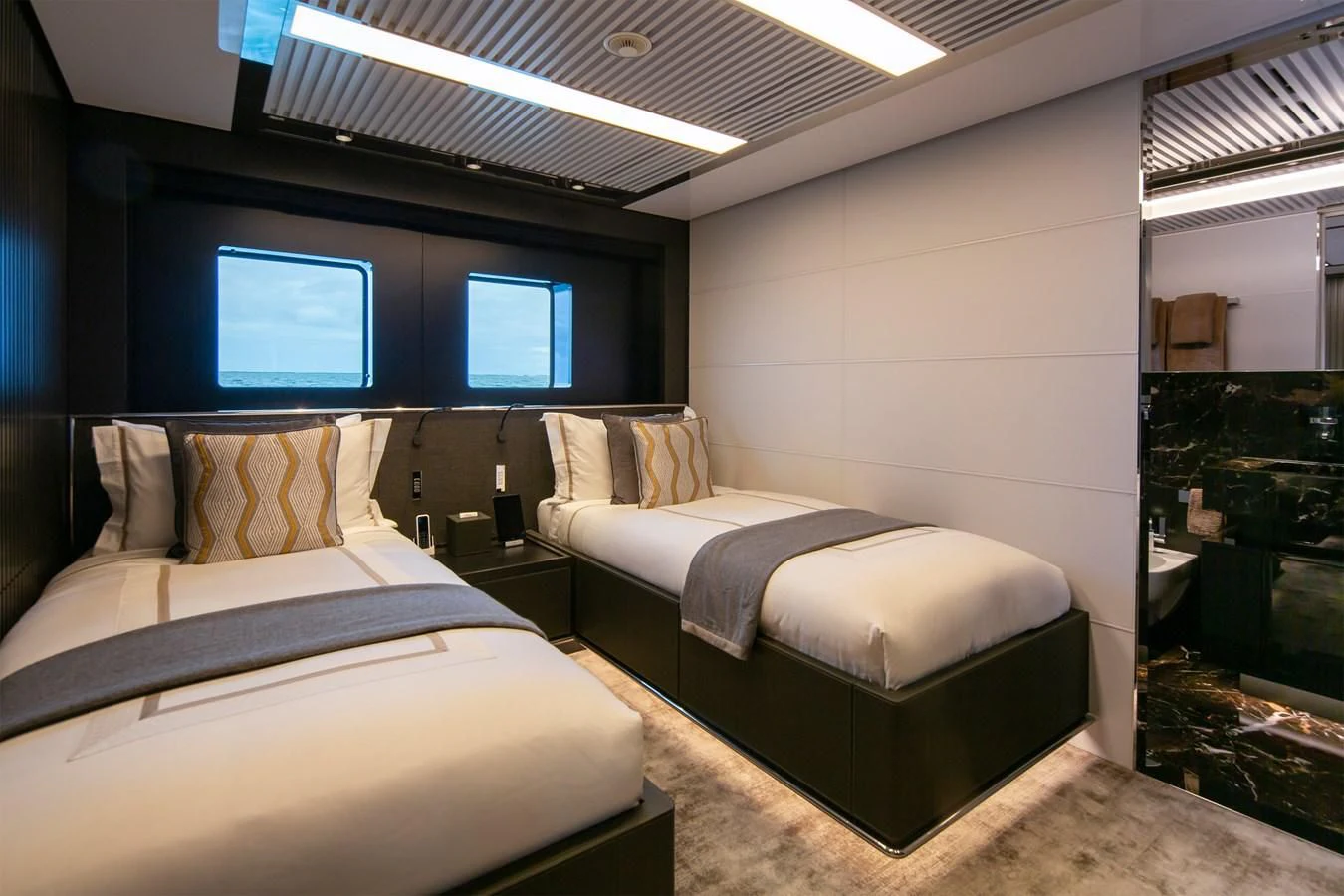 a room with two beds aboard FIFTY Yacht for Charter