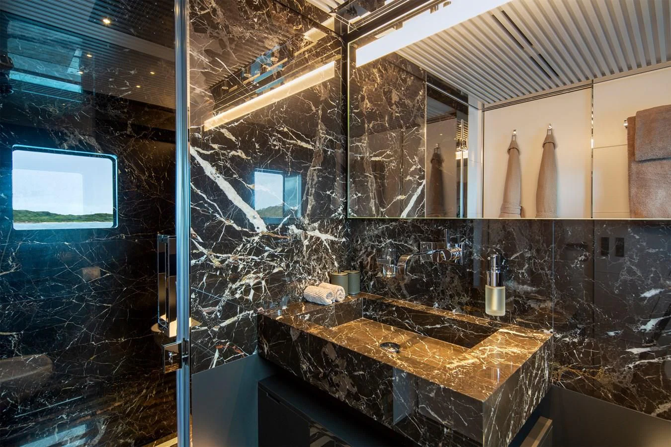 a bathroom with a marble counter top aboard FIFTY Yacht for Charter