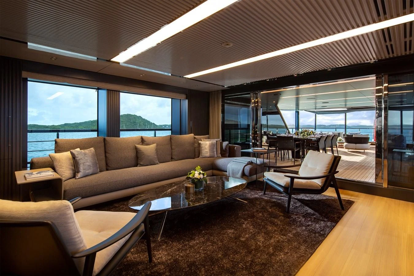 a living room with a large window aboard FIFTY Yacht for Charter