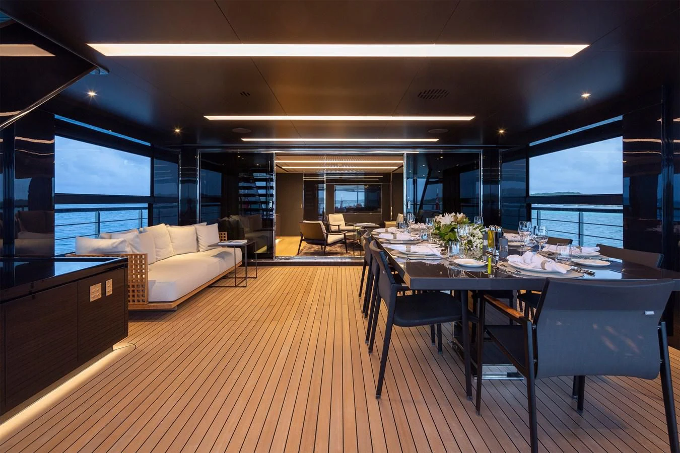 a room with a table and chairs aboard FIFTY Yacht for Charter