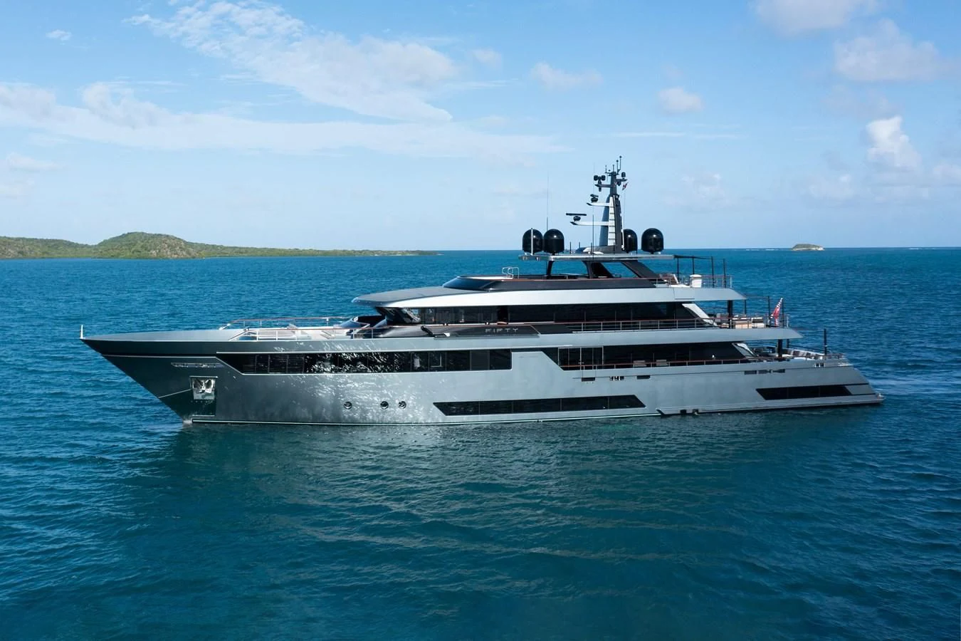a large ship in the water aboard FIFTY Yacht for Charter