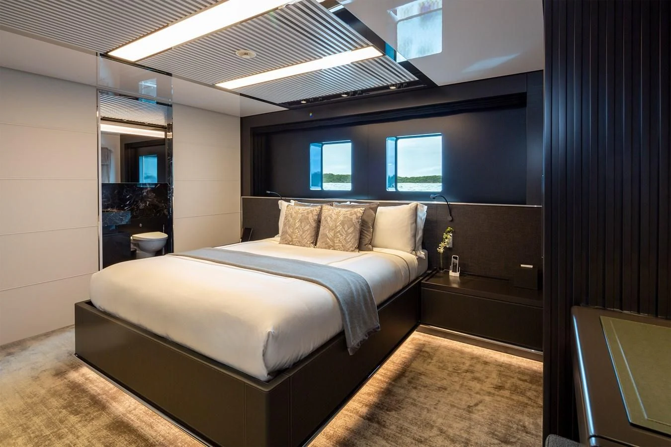 a bed in a room aboard FIFTY Yacht for Charter