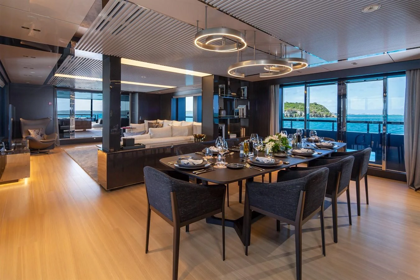 a dining table in a living room aboard FIFTY Yacht for Charter
