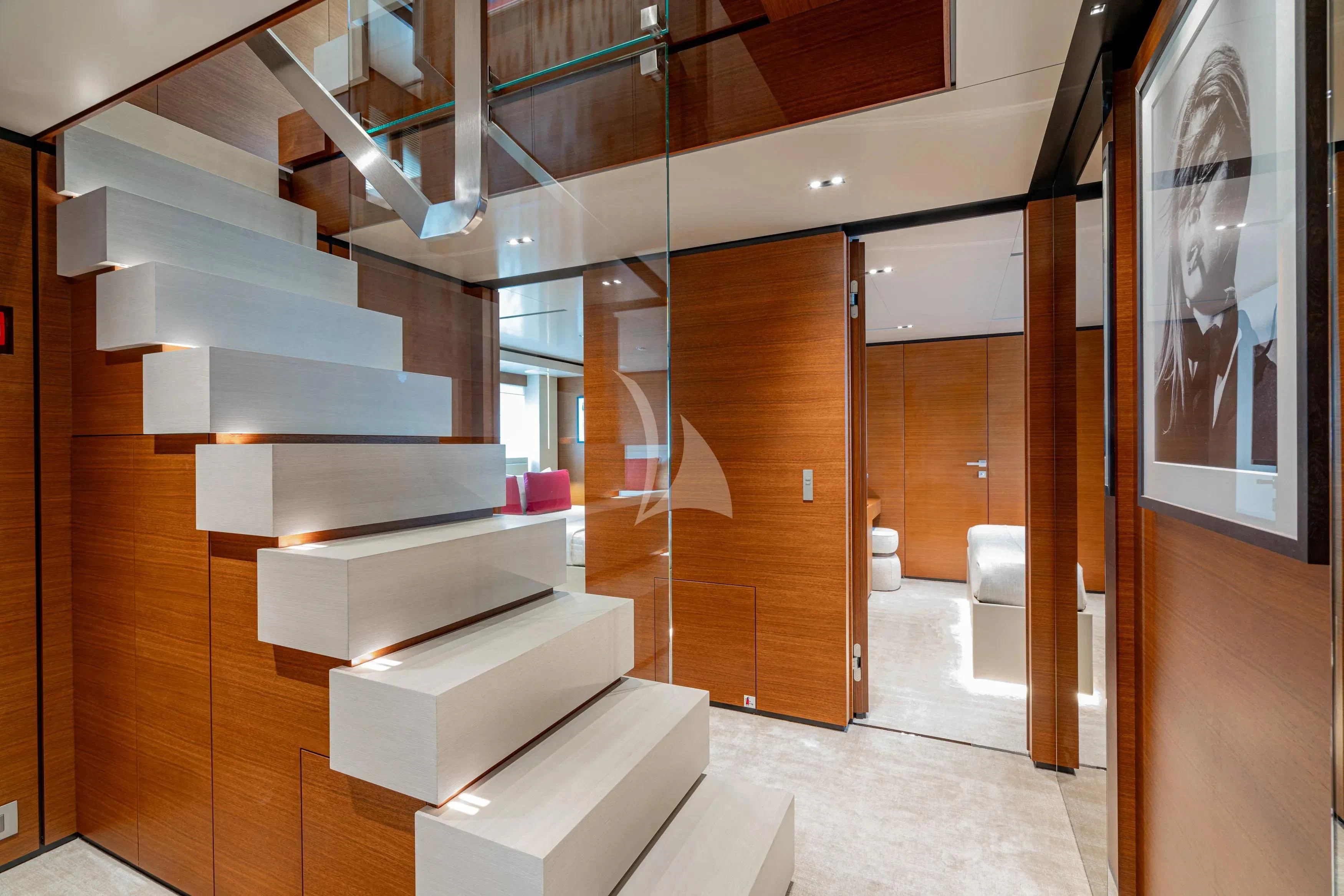 a room with a staircase and a staircase aboard DIANA II Yacht for Sale