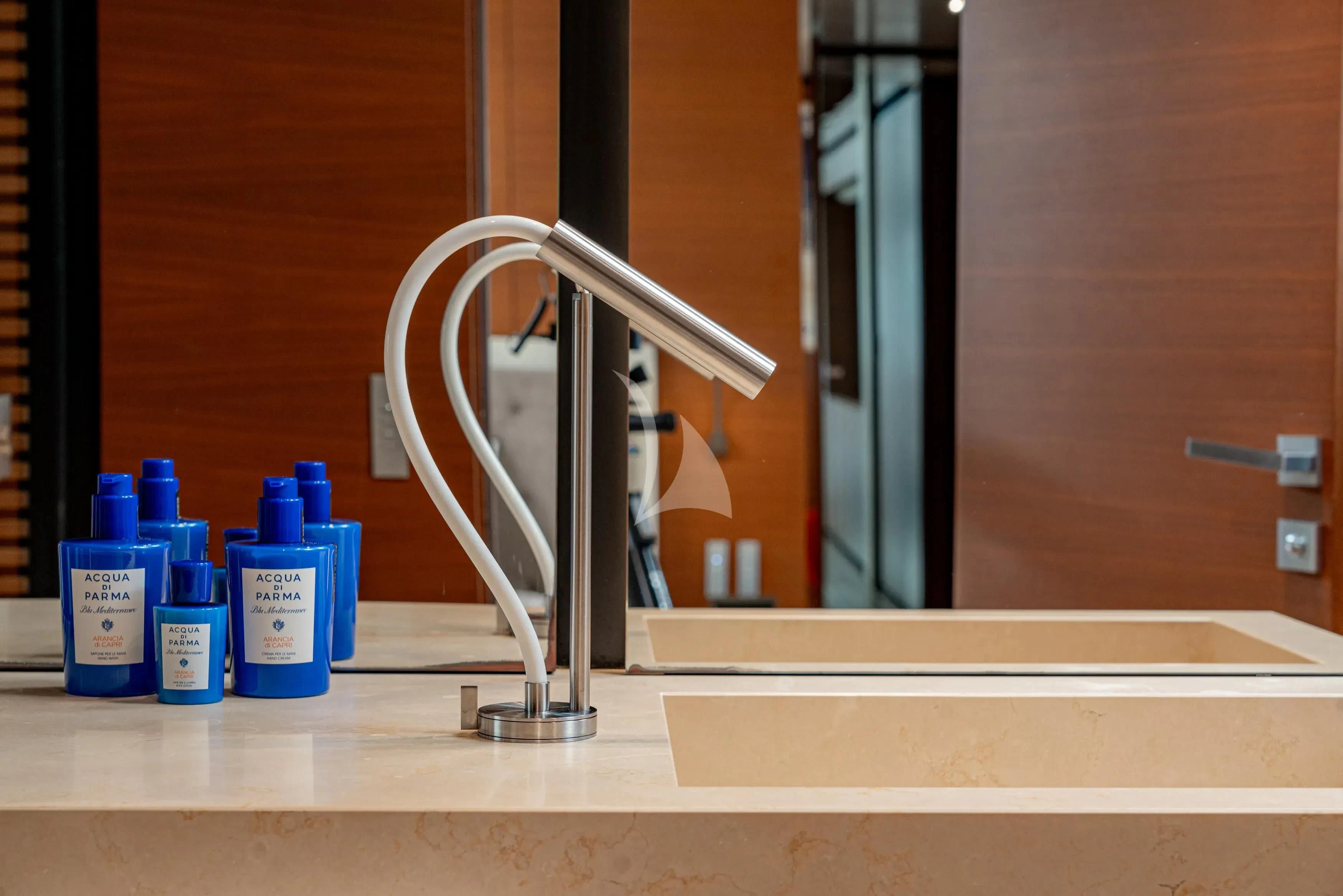a faucet in a bathroom aboard DIANA II Yacht for Sale
