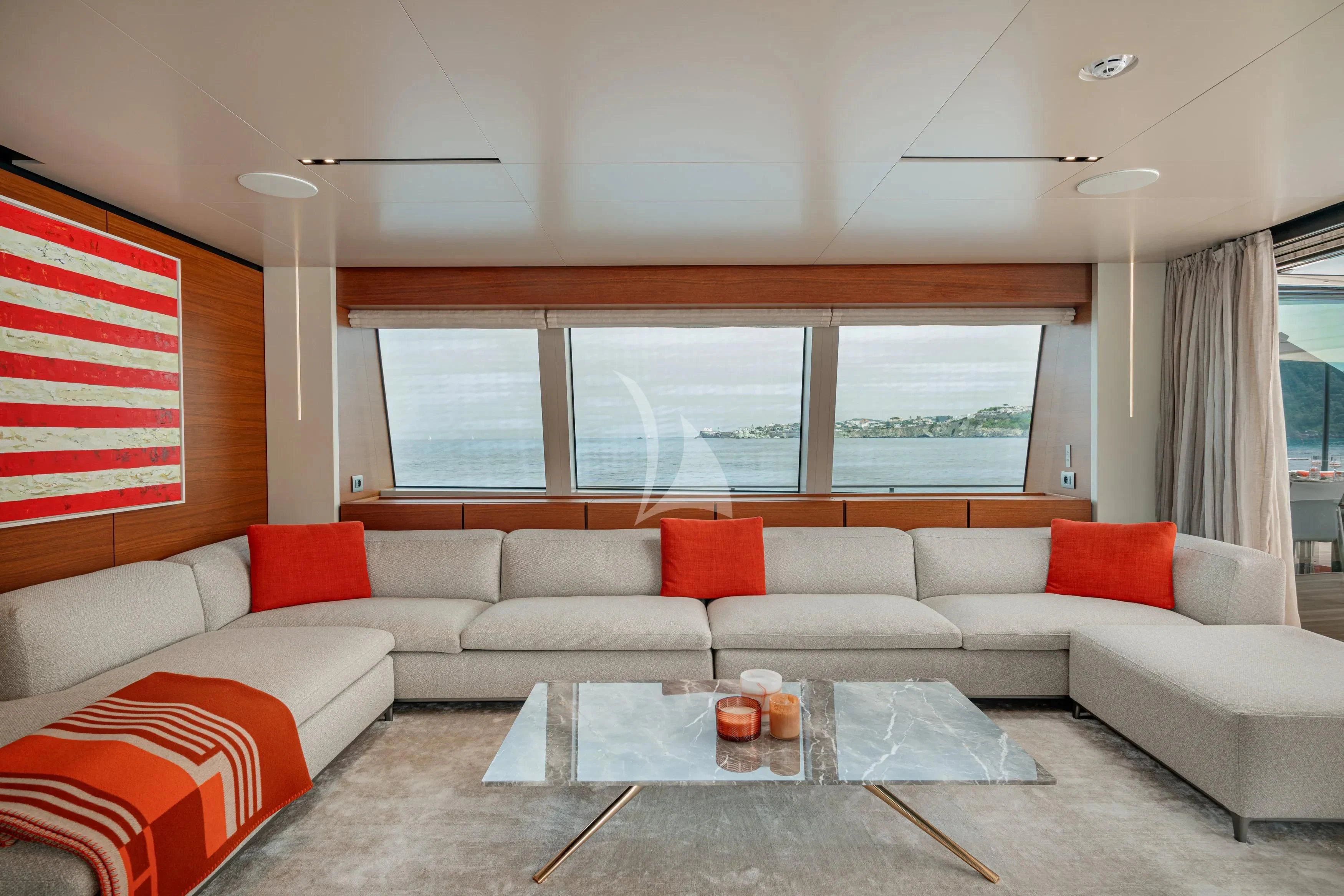 a white couch with a coffee table aboard DIANA II Yacht for Sale