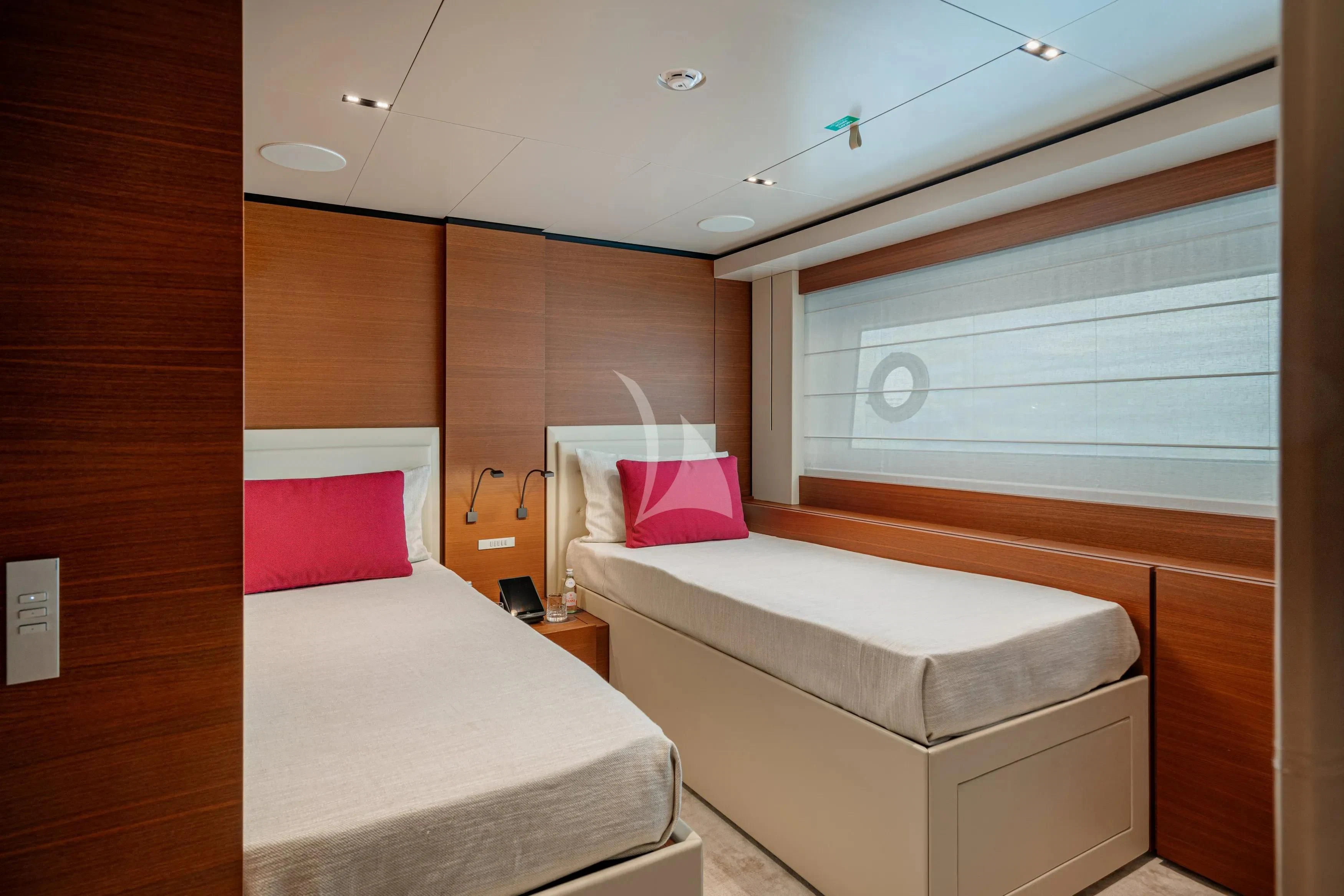 a room with two beds aboard DIANA II Yacht for Sale