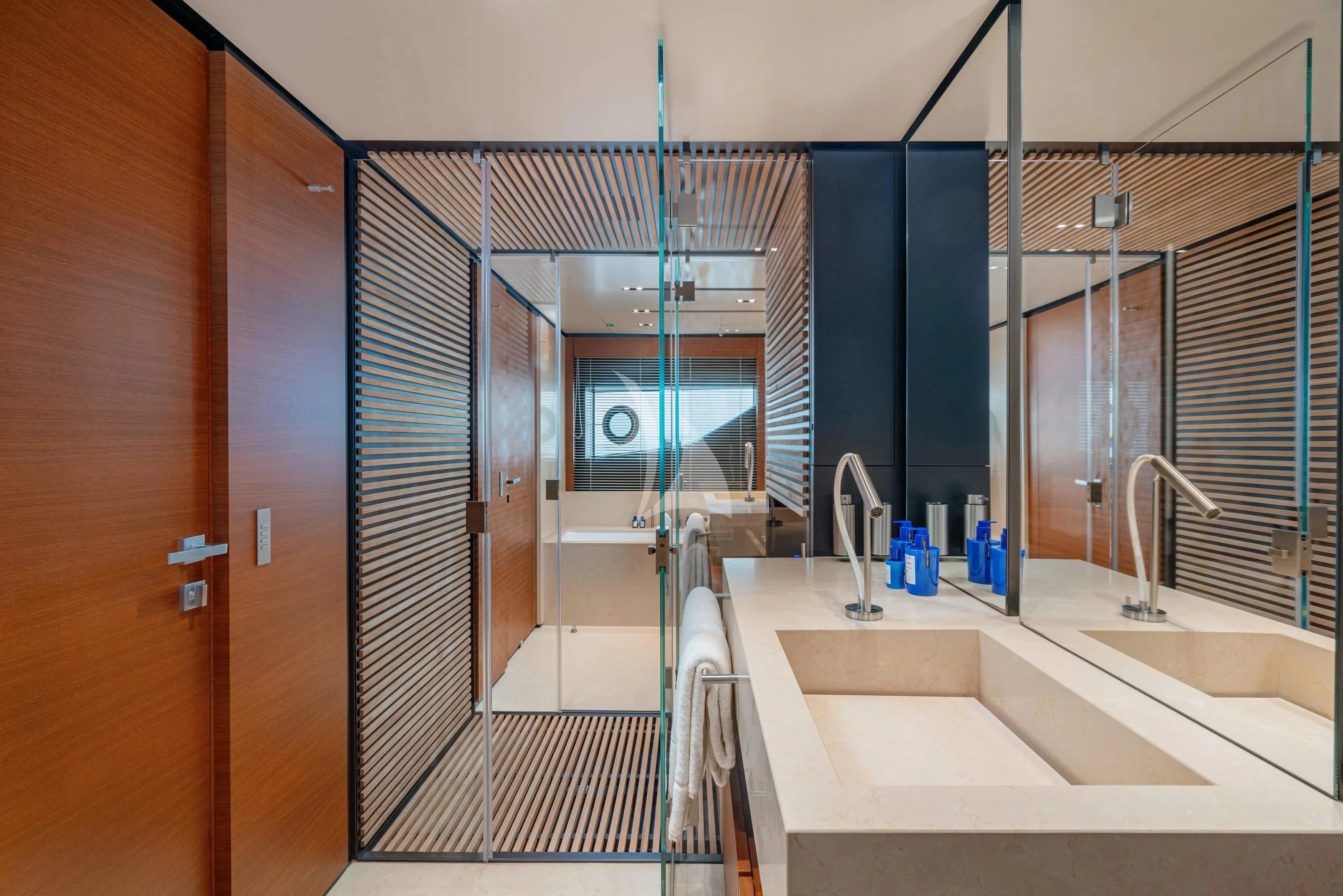 a bathroom with a sink and a shower unit aboard DIANA II Yacht for Sale