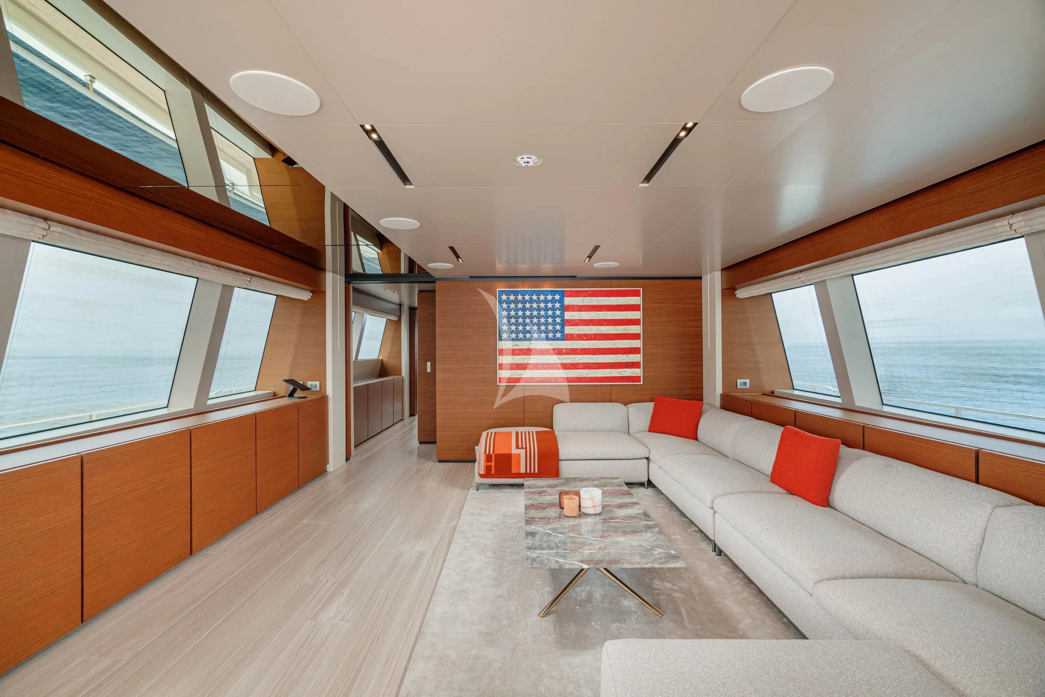 a living room with a large window aboard DIANA II Yacht for Sale