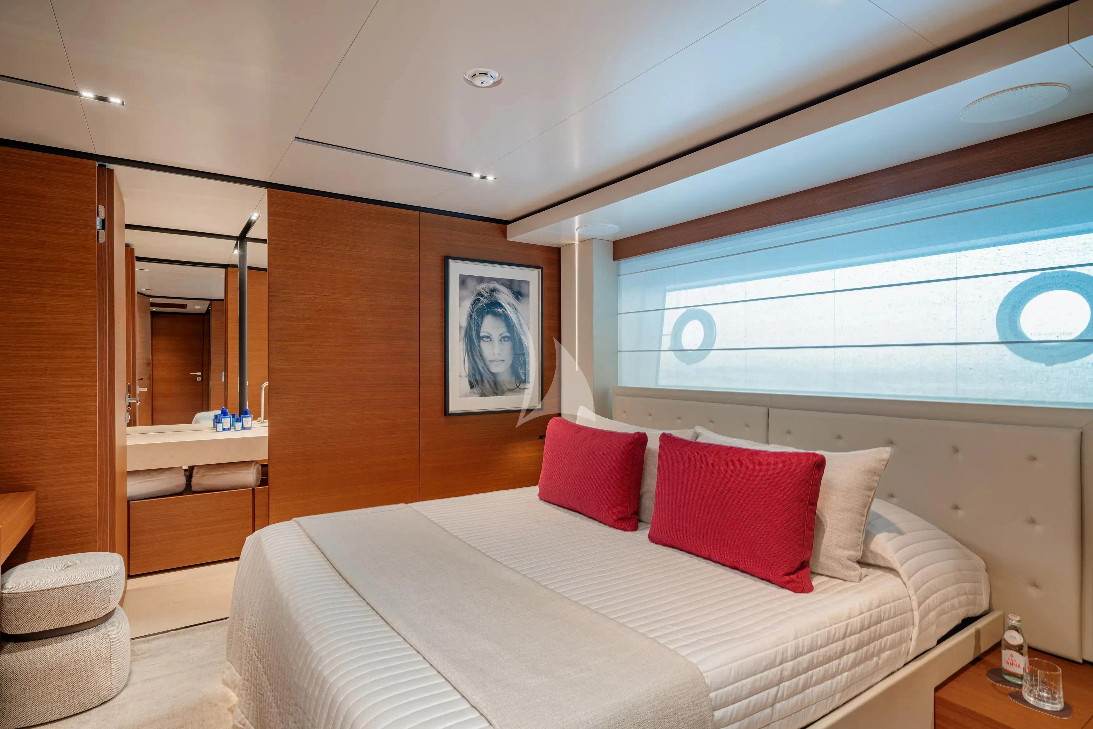 a room with a bed and a desk aboard DIANA II Yacht for Sale