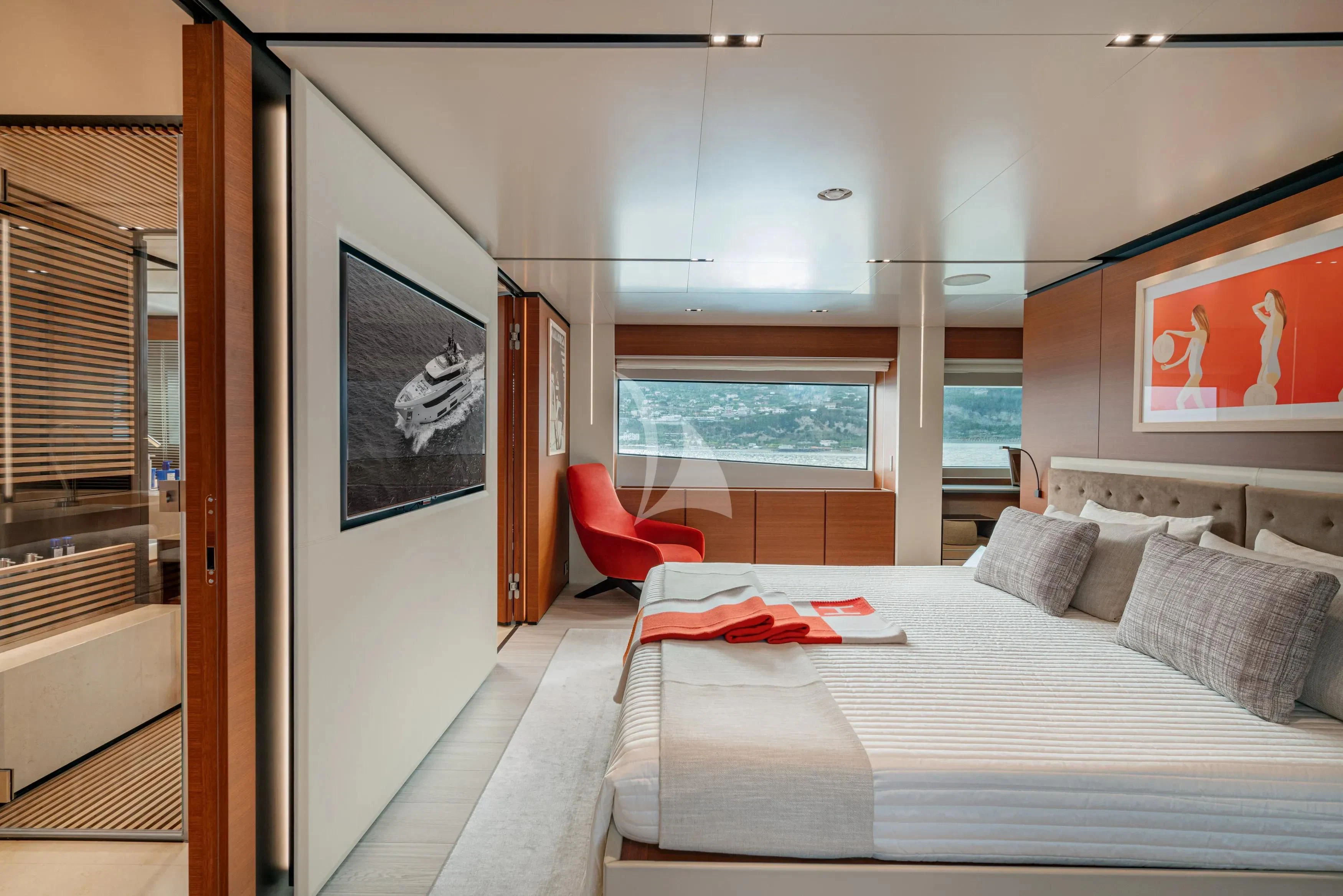 a bedroom with a bed and a window aboard DIANA II Yacht for Sale