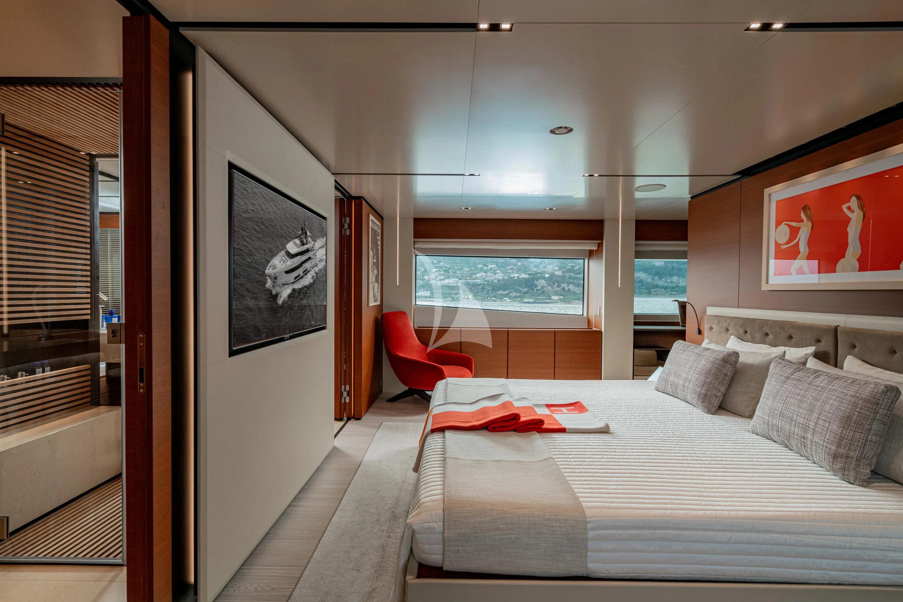 a bedroom with a bed and a window aboard DIANA II Yacht for Sale