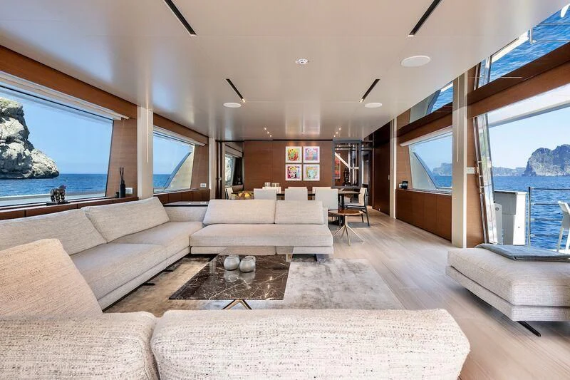 a living room with a large window aboard DIANA II Yacht for Sale