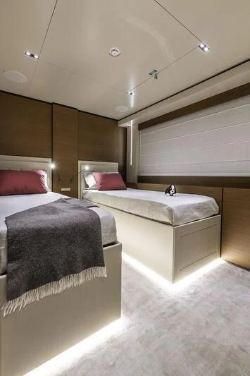 a room with two beds aboard DIANA II Yacht for Sale