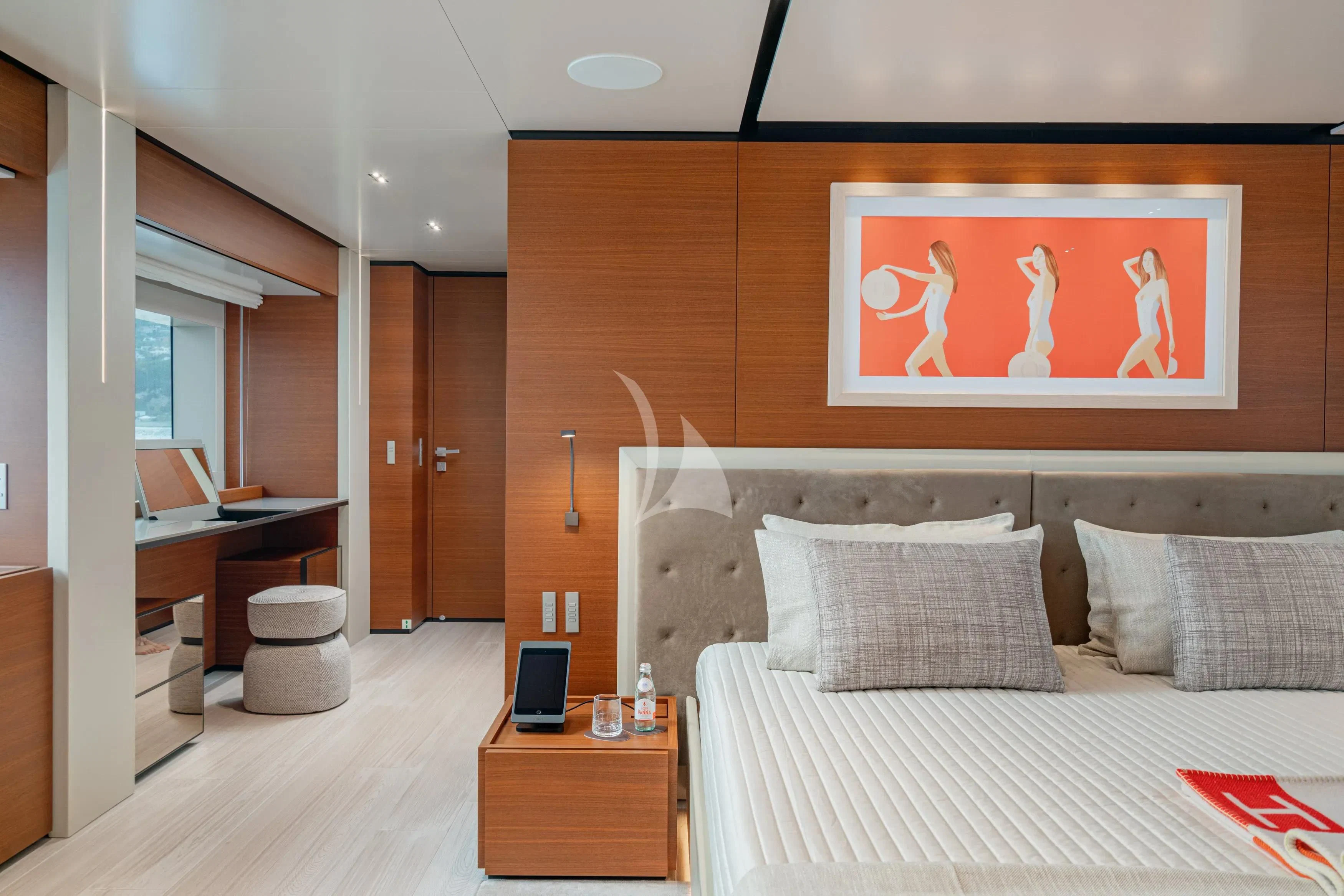 a bedroom with a bed and desk aboard DIANA II Yacht for Sale
