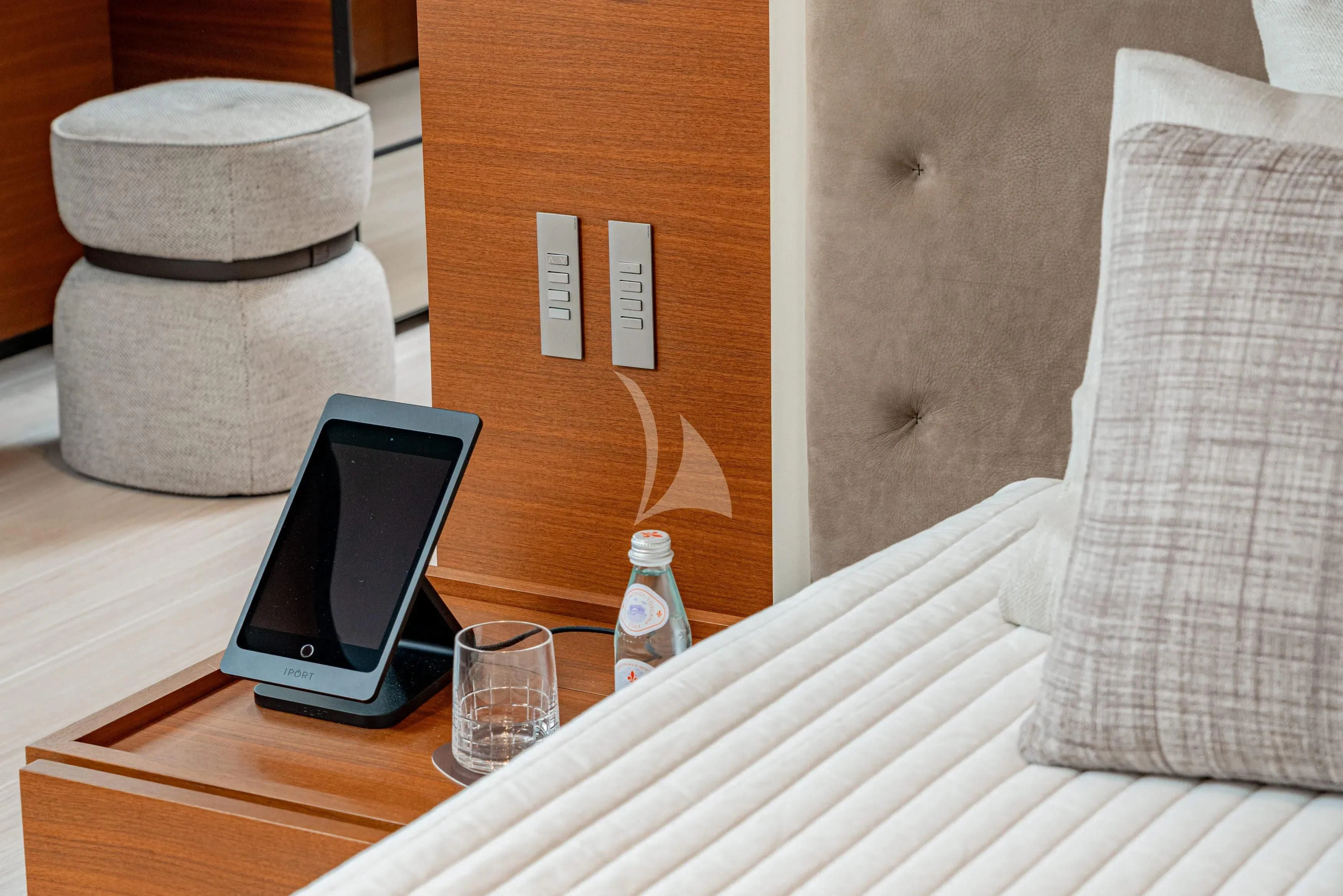 a cell phone on a table aboard DIANA II Yacht for Sale