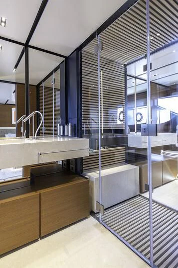 a bathroom with a glass wall aboard DIANA II Yacht for Sale