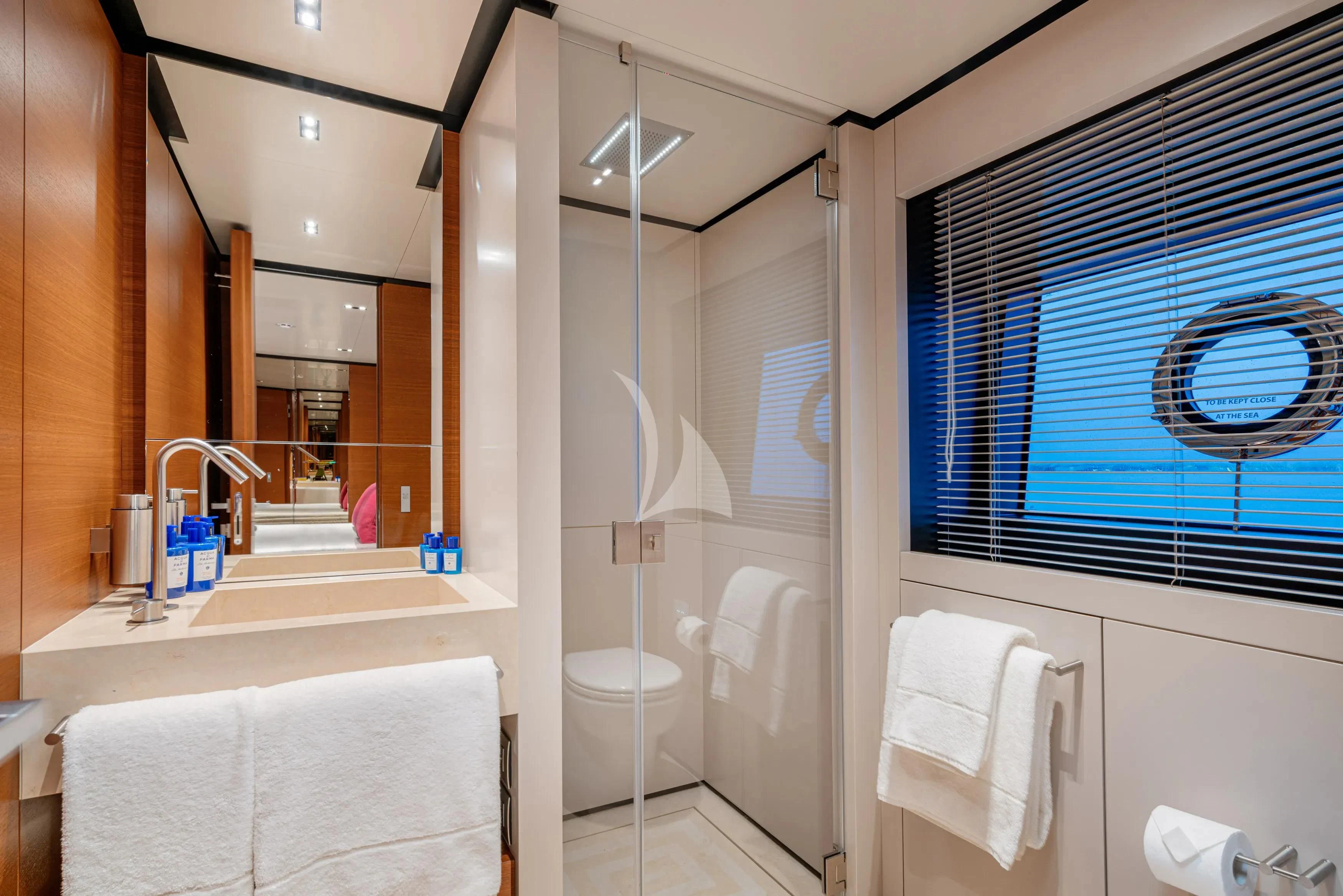 a bathroom with a glass shower aboard DIANA II Yacht for Sale