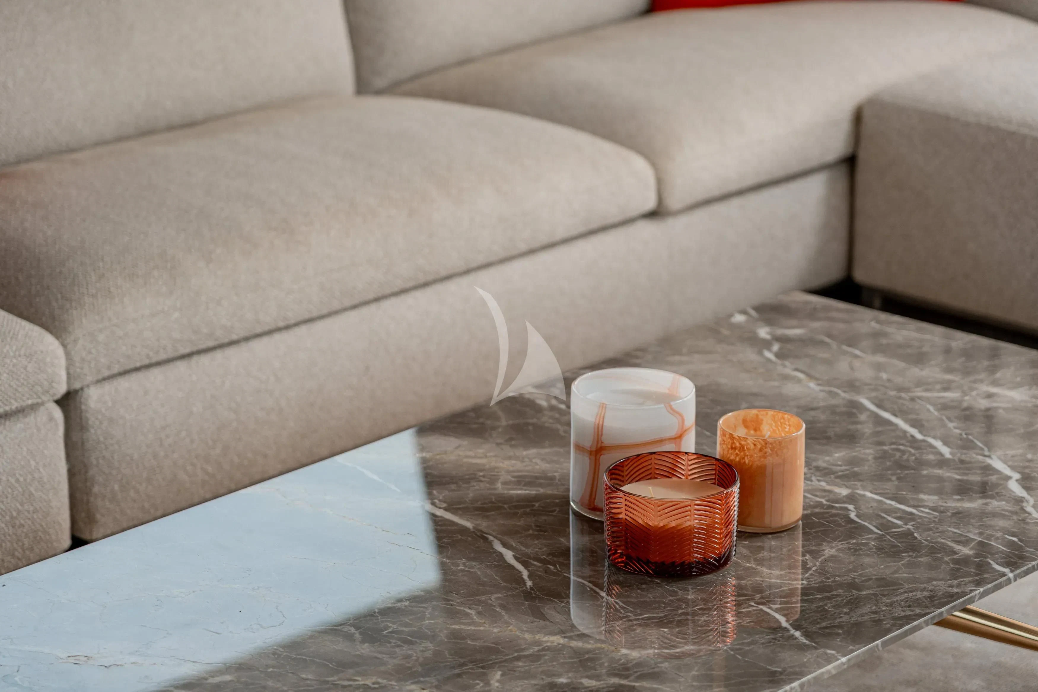 a group of candles on a glass table aboard DIANA II Yacht for Sale