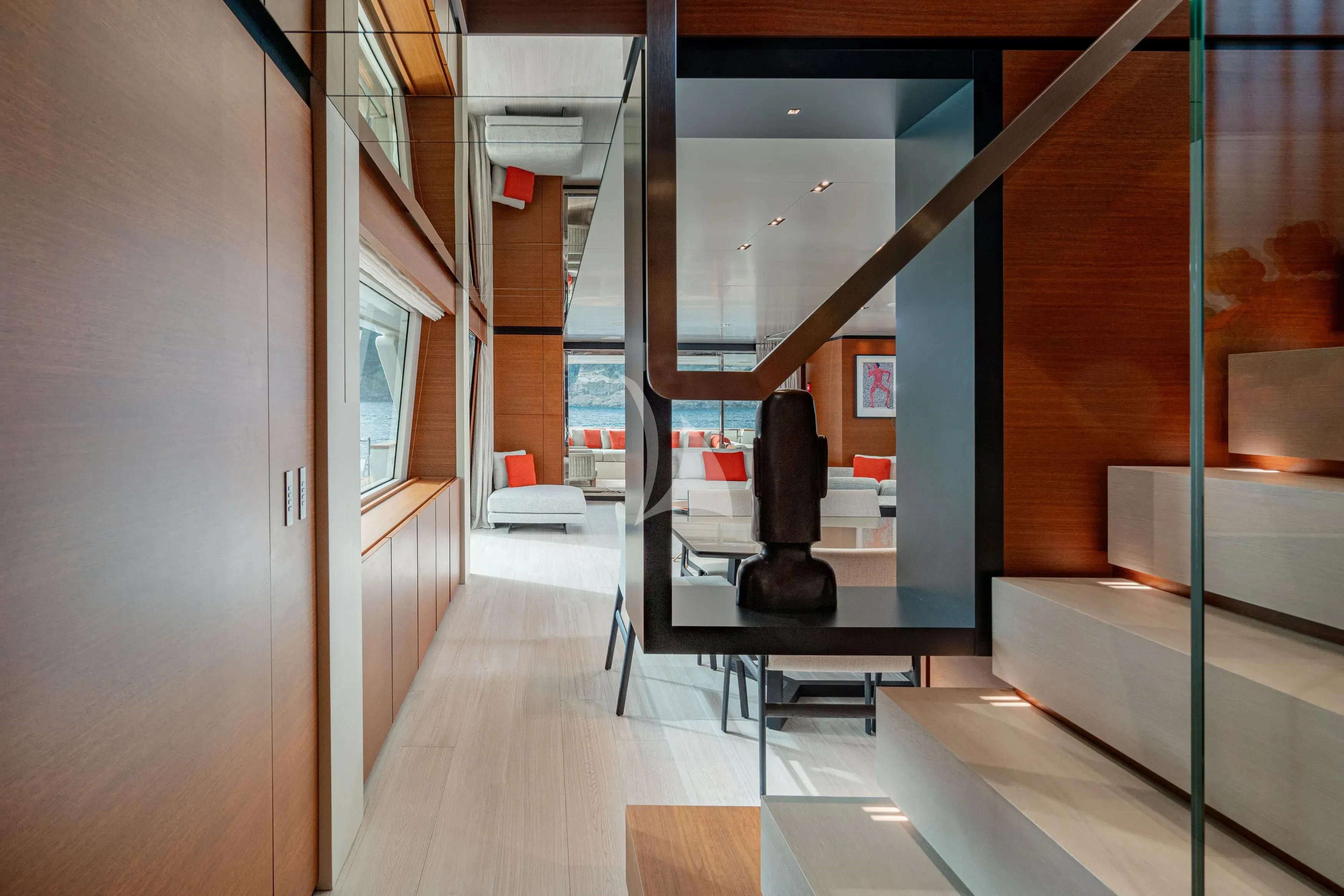 a room with a couch and a table aboard DIANA II Yacht for Sale