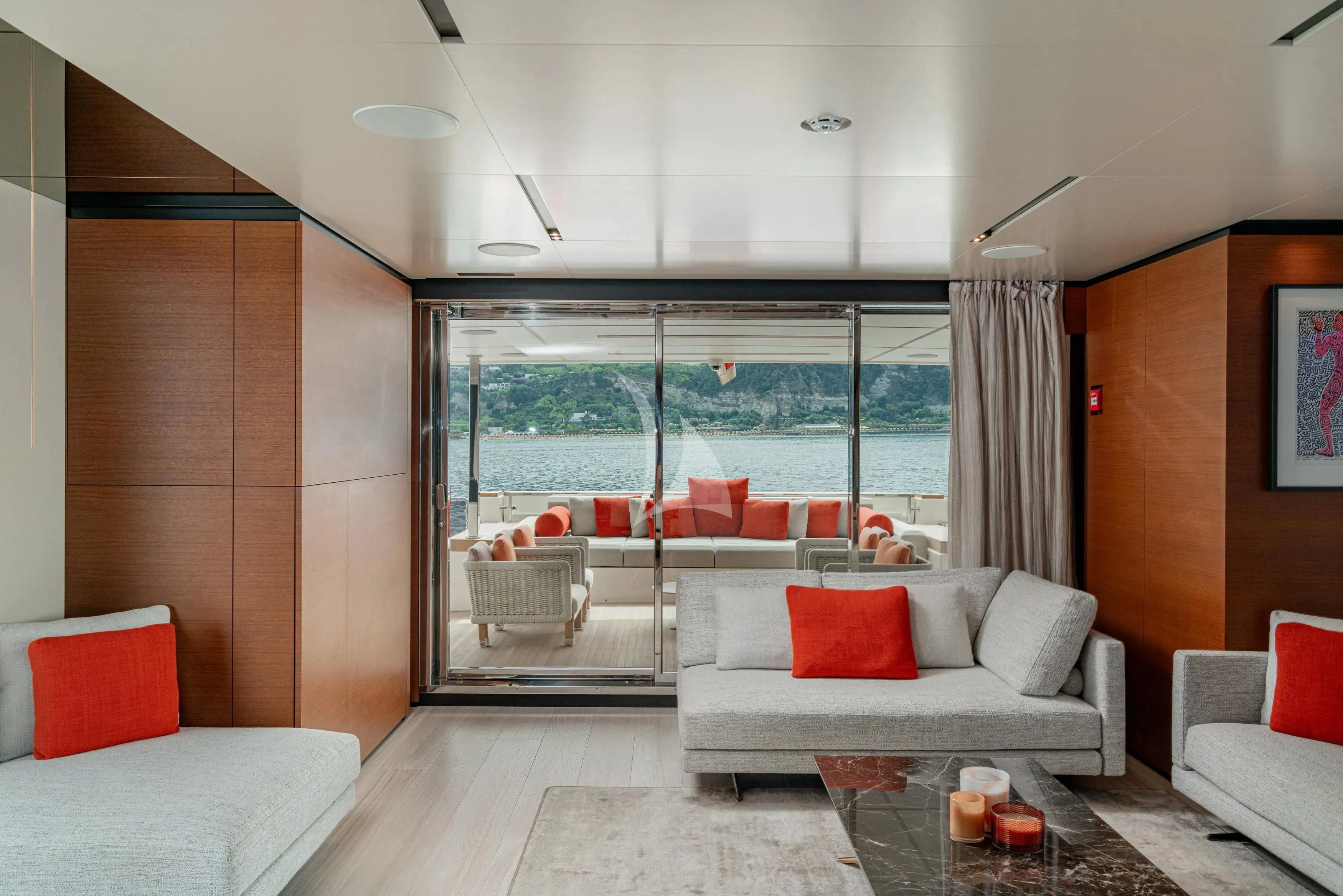 a living room with a large window aboard DIANA II Yacht for Sale