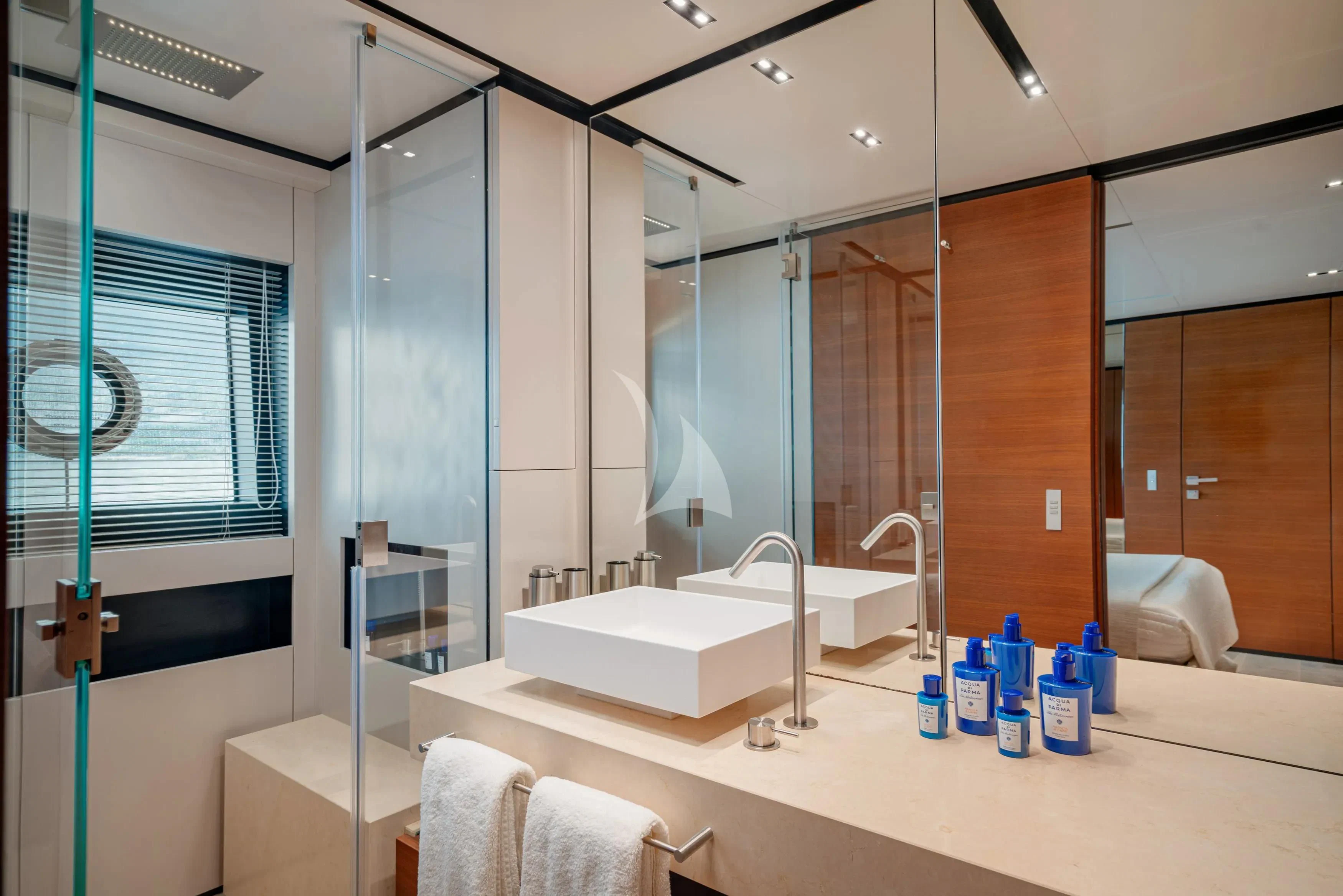 a bathroom with a large mirror aboard DIANA II Yacht for Sale