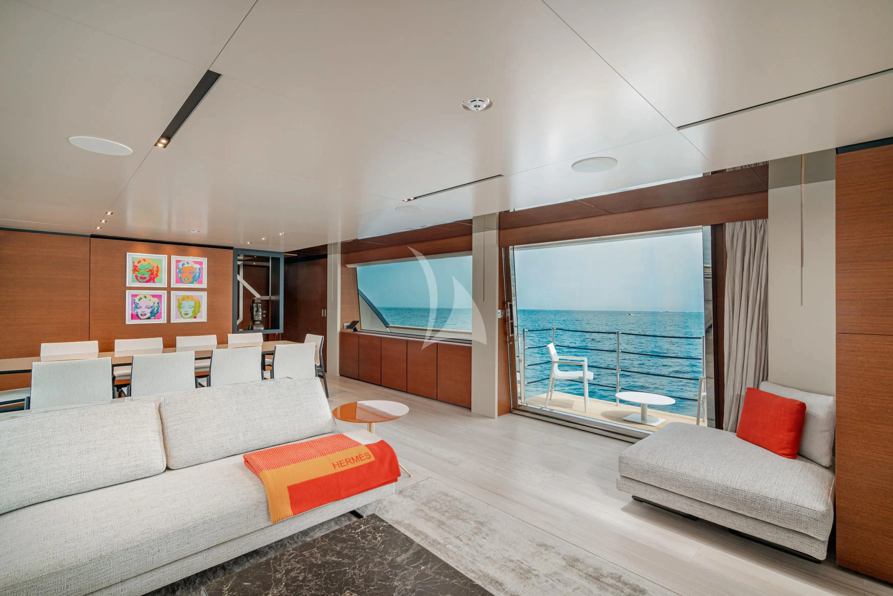 a living room with a large window aboard DIANA II Yacht for Sale