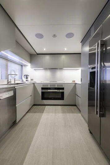 a kitchen with a large island aboard DIANA II Yacht for Sale