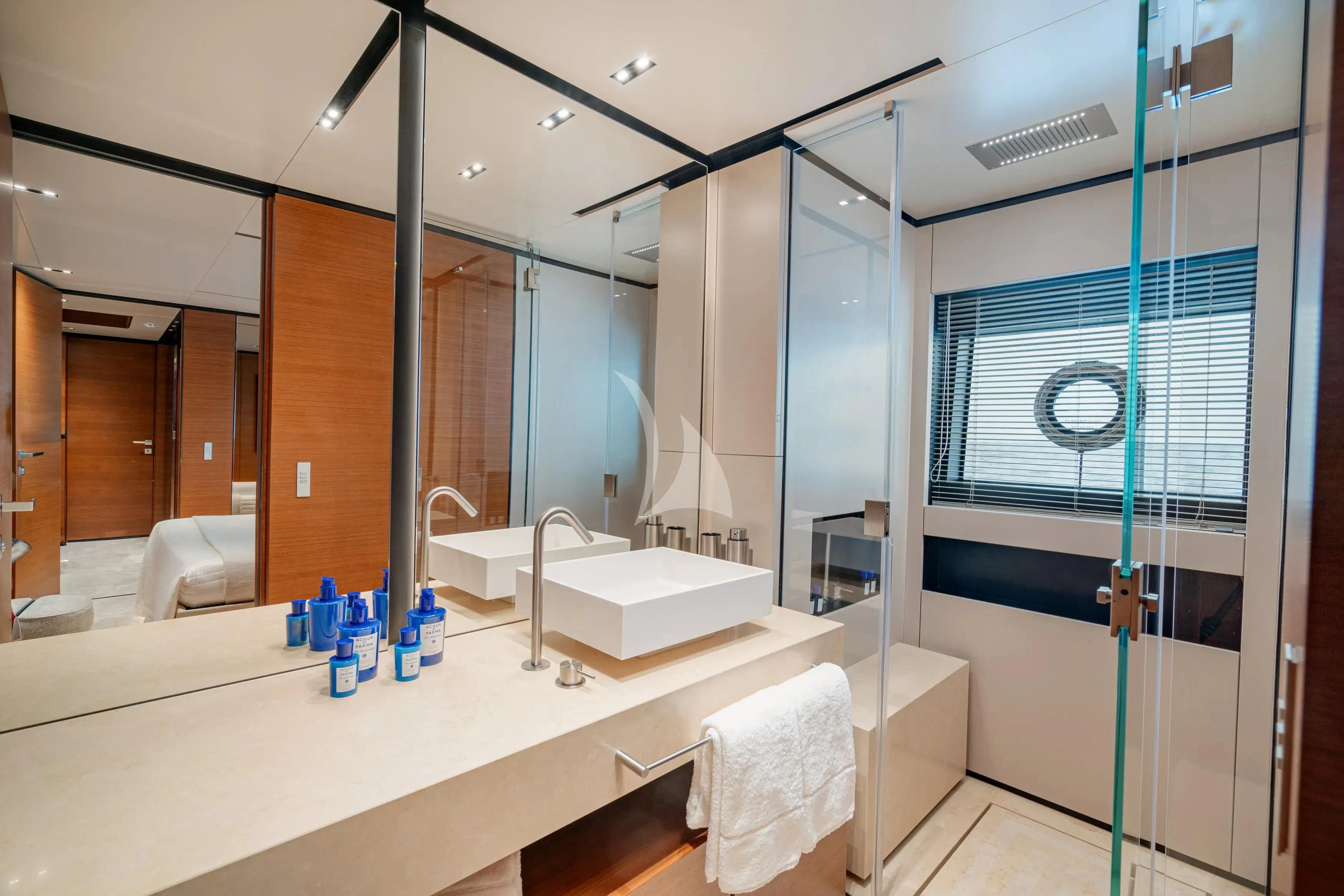 a bathroom with a large mirror aboard DIANA II Yacht for Sale