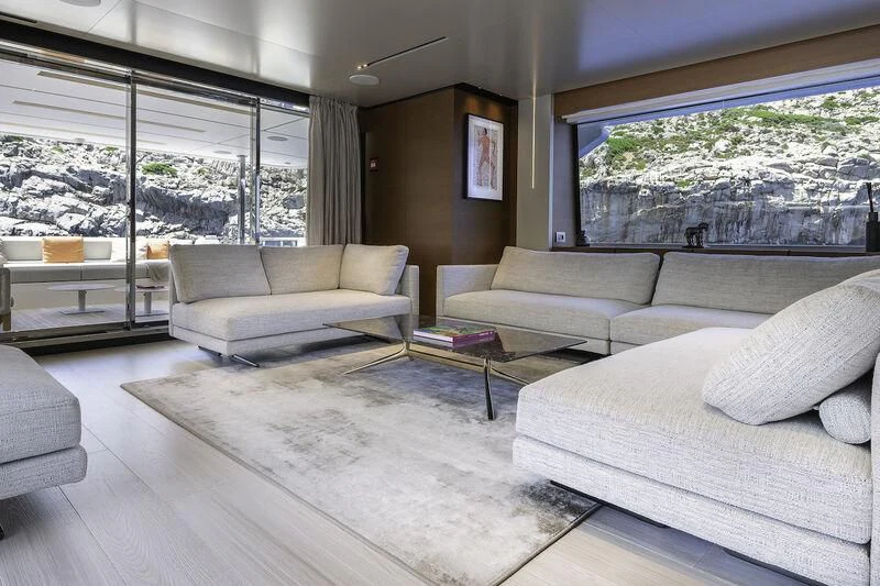 a living room with a large window aboard DIANA II Yacht for Sale