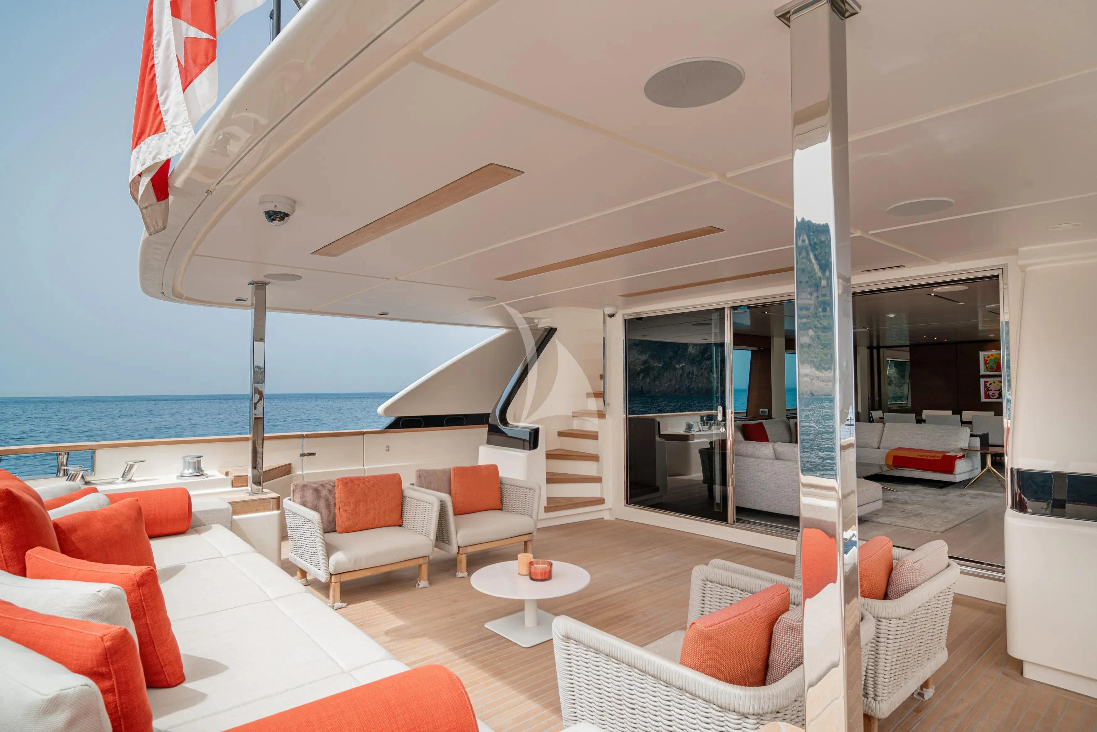 a room with a large balcony overlooking the ocean aboard DIANA II Yacht for Sale