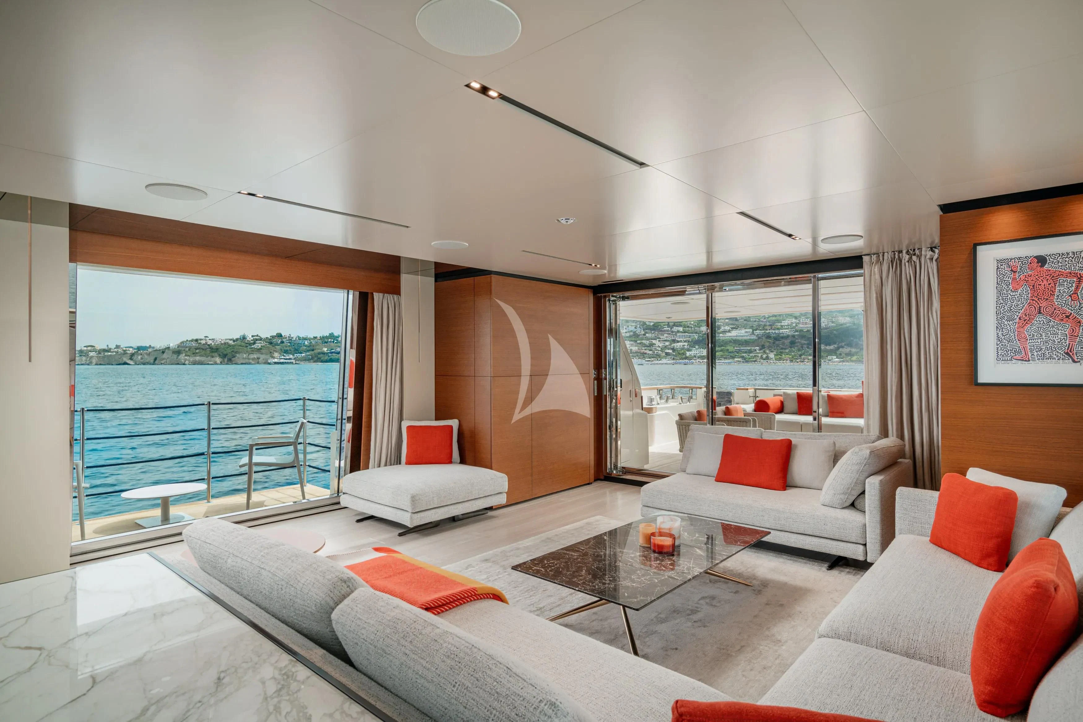 a living room with a large window aboard DIANA II Yacht for Sale