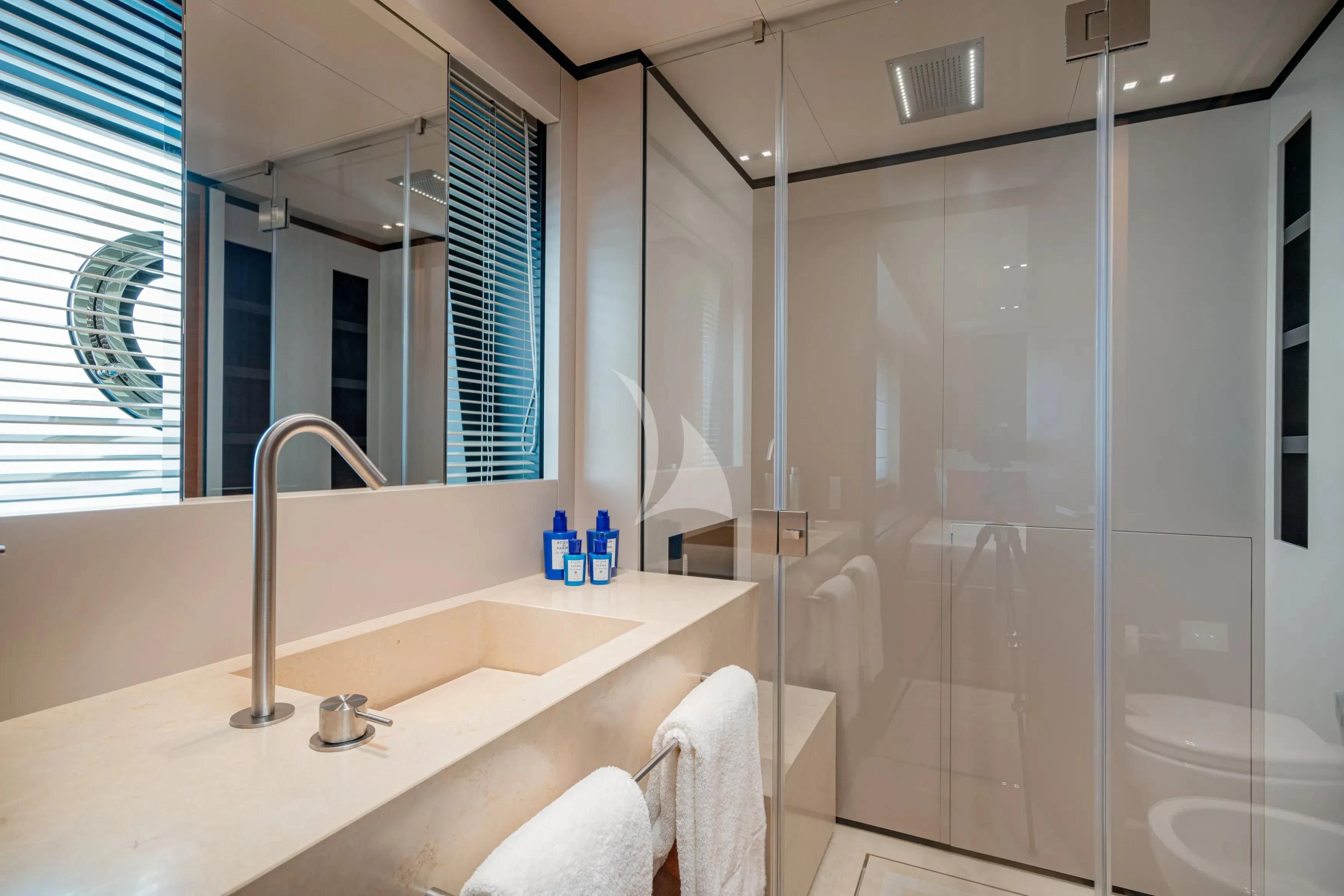 a bathroom with a glass shower aboard DIANA II Yacht for Sale