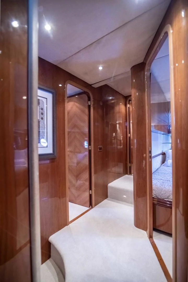 a room with a bed and a mirror aboard ENCHANTED LADY Yacht for Sale