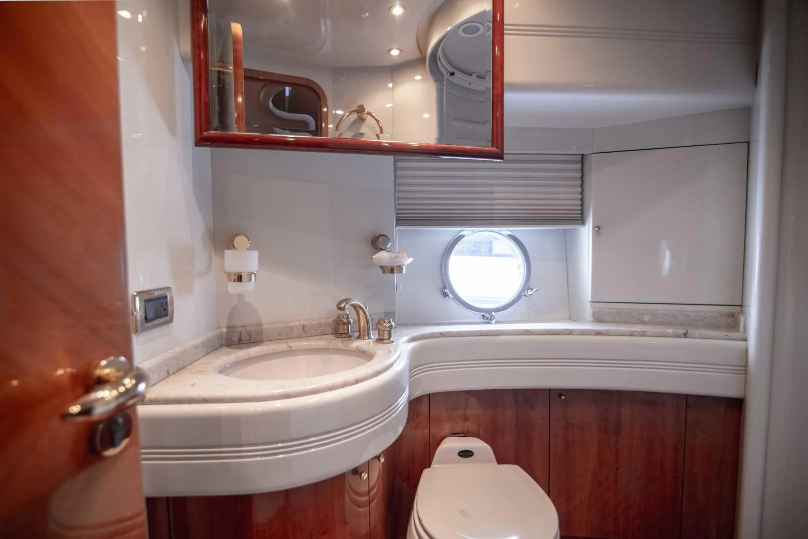 a bathroom with a mirror and a sink aboard ENCHANTED LADY Yacht for Sale