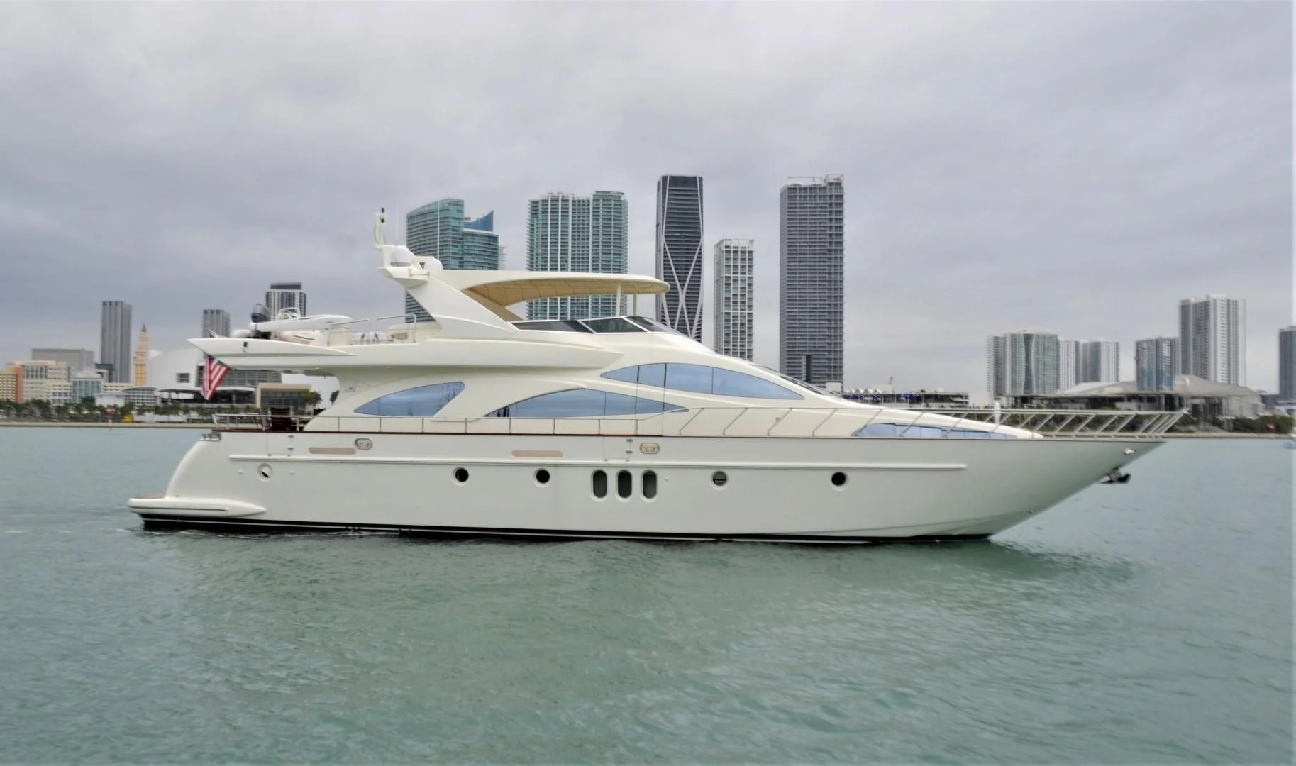 a white yacht in the water aboard ENCHANTED LADY Yacht for Sale