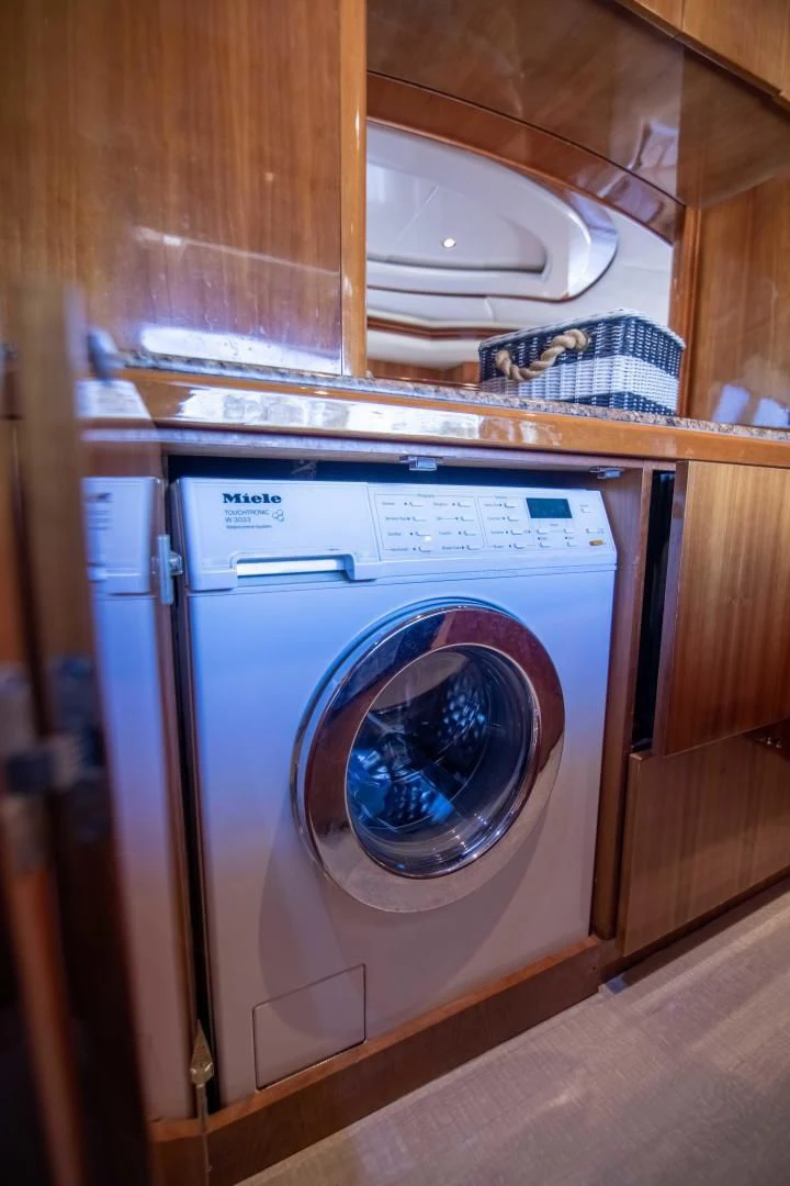 a white washing machine aboard ENCHANTED LADY Yacht for Sale