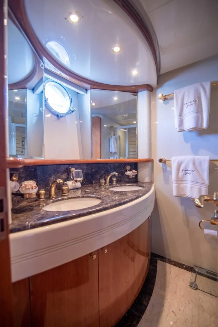 a bathroom with a large mirror aboard ENCHANTED LADY Yacht for Sale