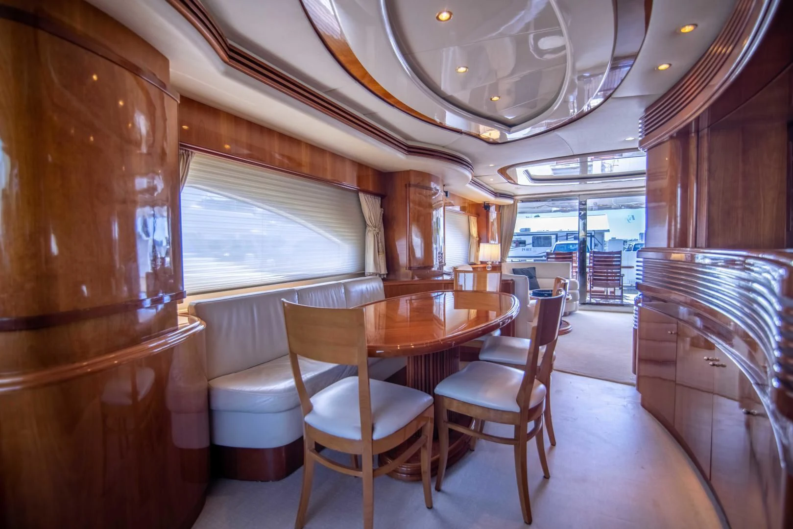 a dining room with wood furniture aboard ENCHANTED LADY Yacht for Sale