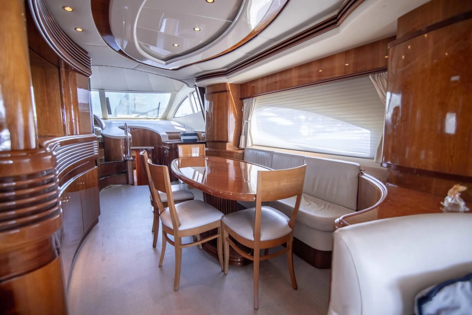 a dining room with chairs and a table aboard ENCHANTED LADY Yacht for Sale