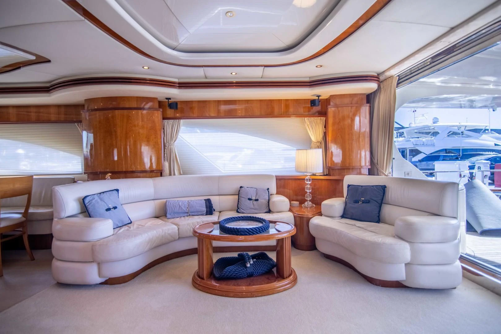 a living room with a large wood fireplace aboard ENCHANTED LADY Yacht for Sale