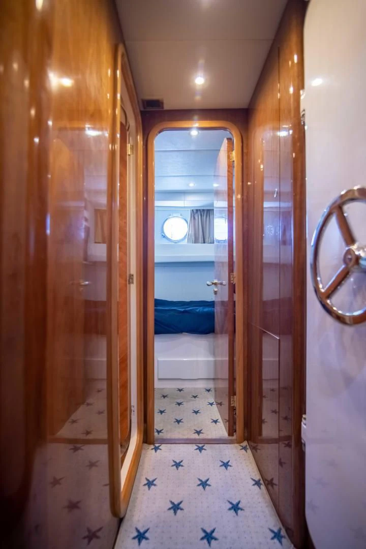 a room with a glass door aboard ENCHANTED LADY Yacht for Sale