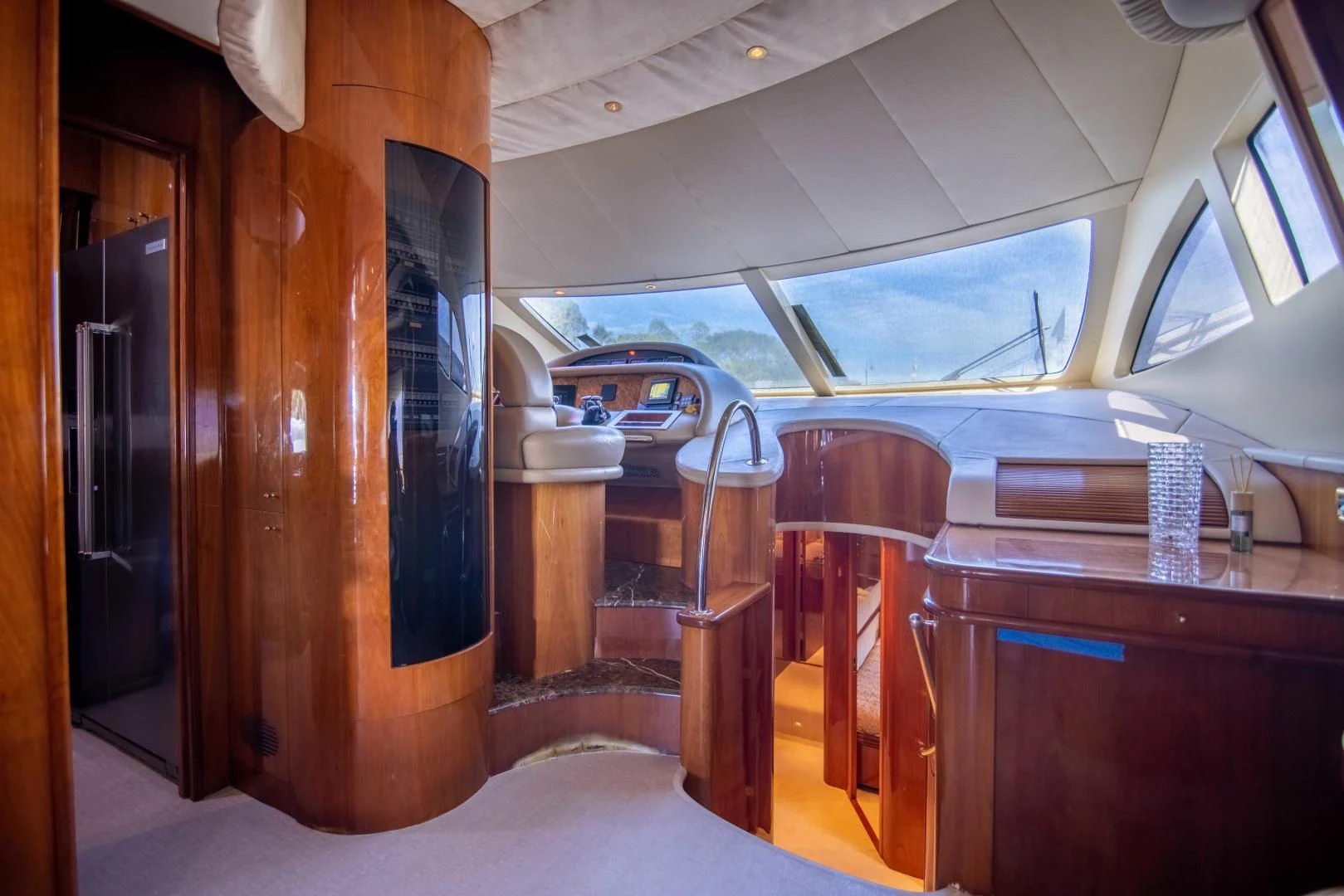 a room with wooden furniture aboard ENCHANTED LADY Yacht for Sale