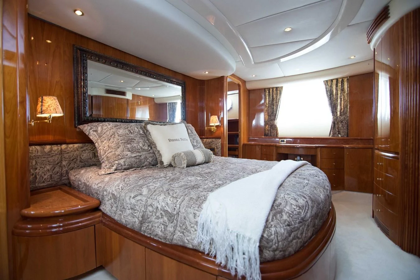 a large bed in a room aboard ENCHANTED LADY Yacht for Sale