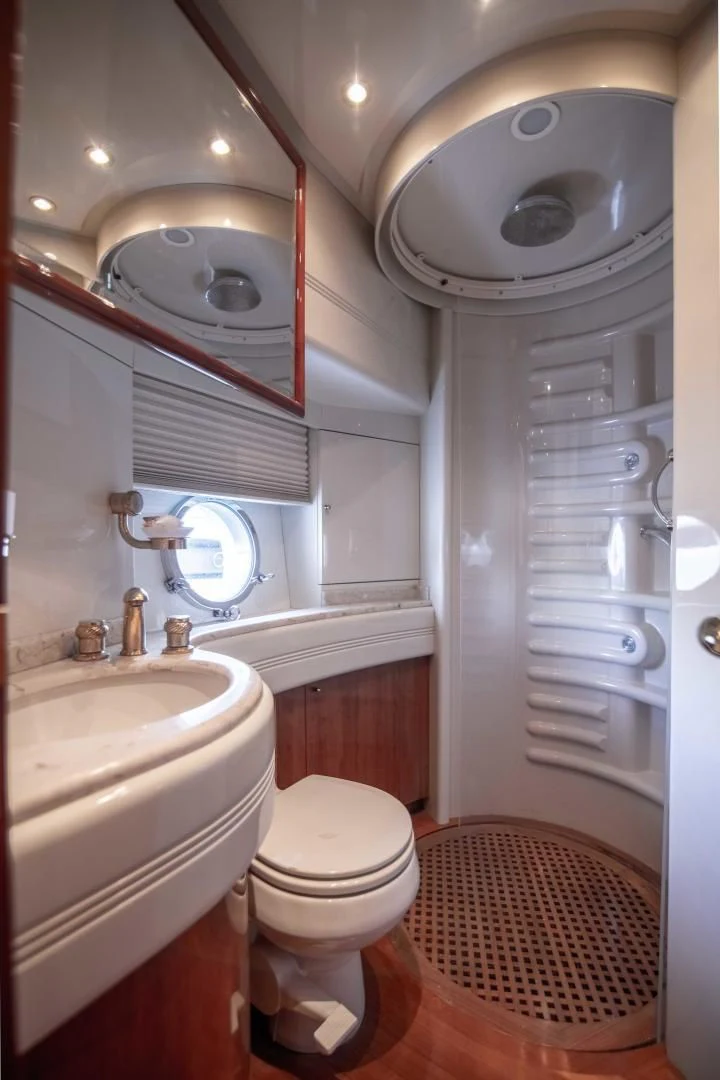 a bathroom with a toilet and sink aboard ENCHANTED LADY Yacht for Sale